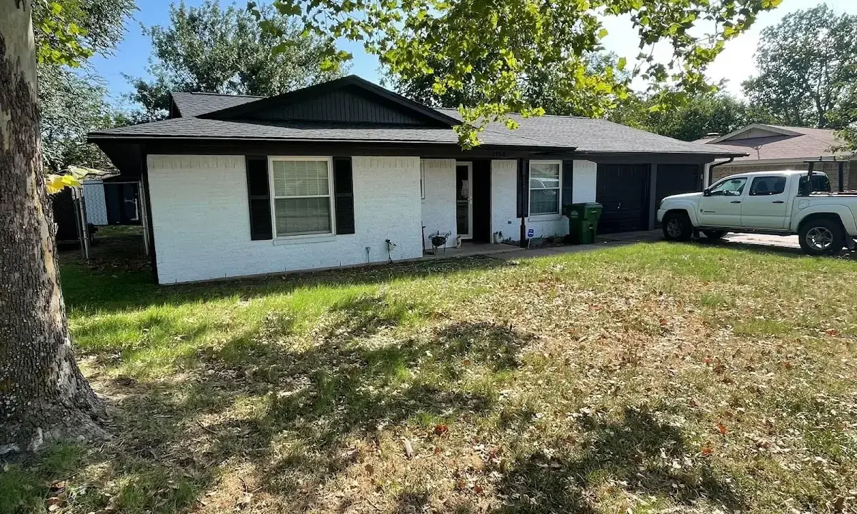 Professional roofing crew working on a residential roof in Salisbury